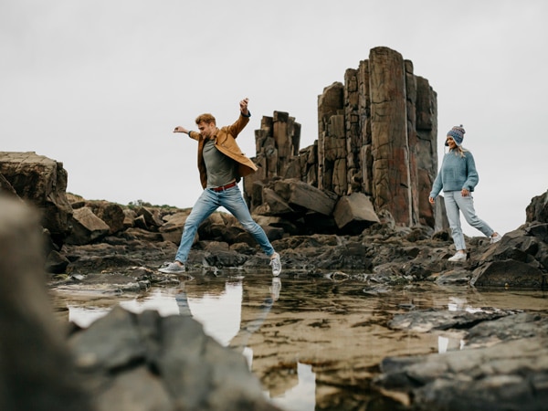 a couple exploring Bombo on the Sapphire Coast, NSW