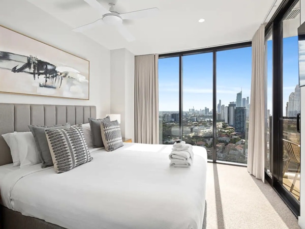 a bedroom with city views at Cassa Encore Apartment, Broadbeach