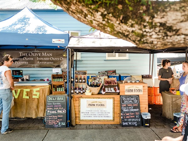 kiosks selling organic farm goods at Eumundi Markets