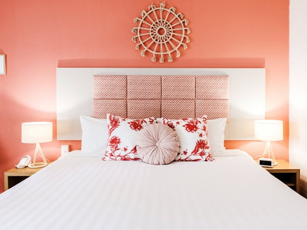 a pastel-hued bed at Greenmount Beach House