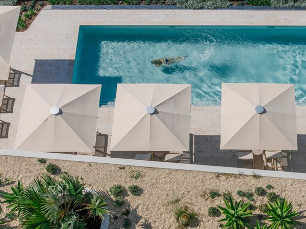 a person swimming in the pool at Kirra Point Holiday Apartments