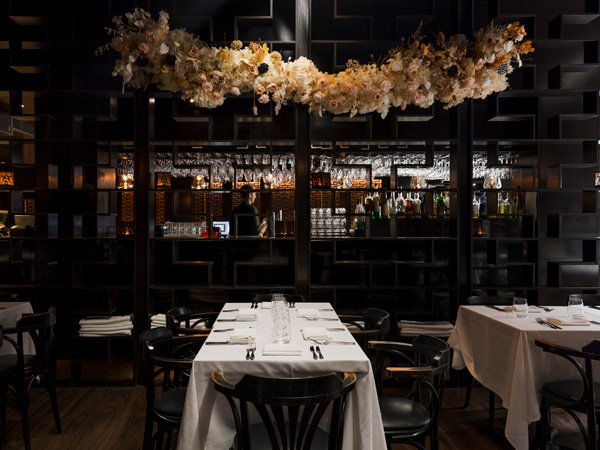 the dimly lit dining interior of Locale restaurant, Noosa