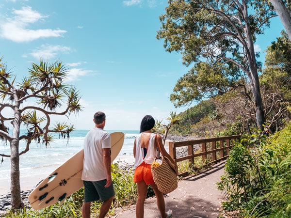 a couple walking along Noosa National Park