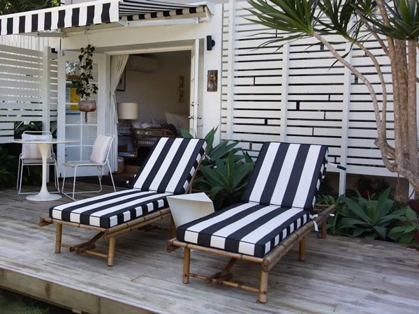 striped sun loungers in a garden at The Pool House Coolangatta