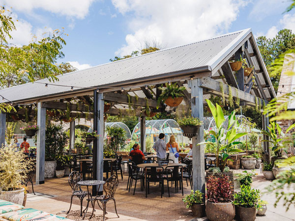 al fresco dining in a garden setting at The Doonan