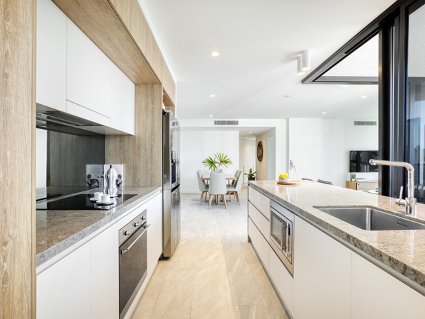 an elegant marble kitchen at Vue Broadbeach