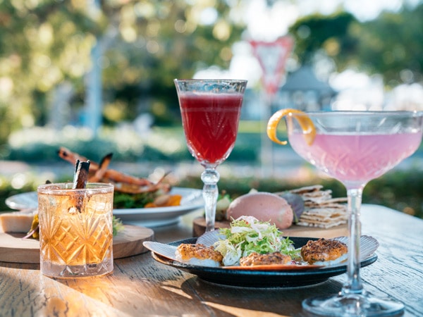 meal with cocktail drinks on the side at Whisky Boy, Noosa