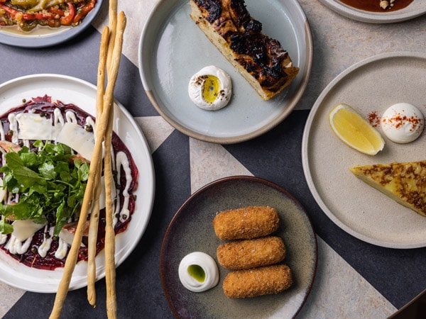 a table-top view of the dishes at Alibi, Ovolo Woolloomooloo, 6 Cowper Wharf Roadway, Woolloomooloo