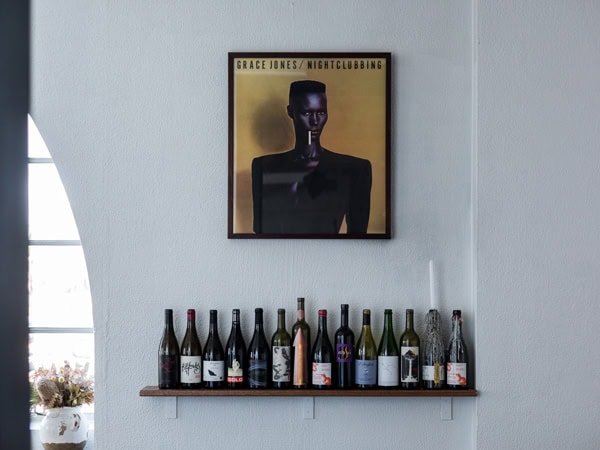 wine bottles displayed on the wall at Bar Rochford, Canberra