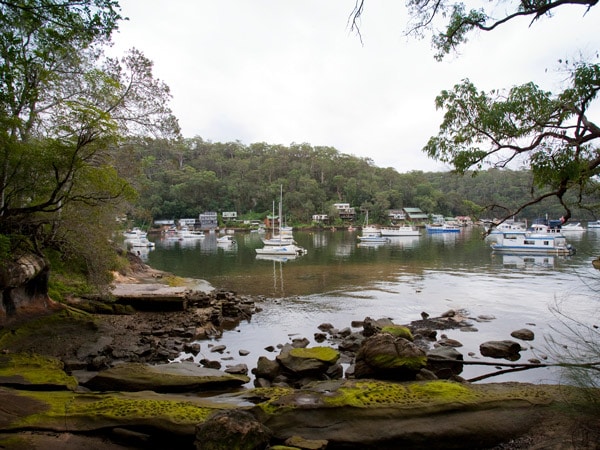 the view of the boats and houses by Berowra Creek from the Benowie Walking Track in Berowra Valley National Park