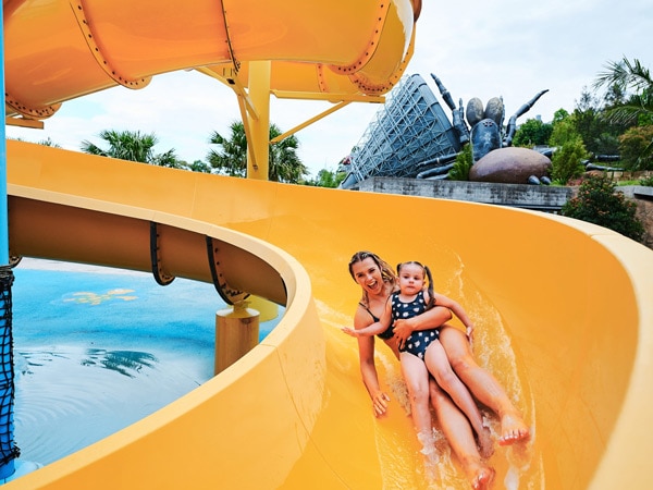 a mother and daughter sliding down the Billabong waterslide