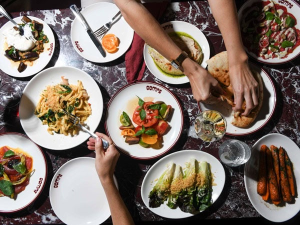 a spread of food on the table at Compa, Canberra