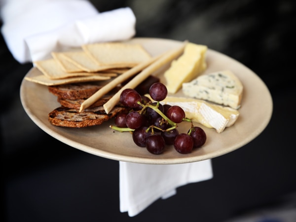 a grape and cheese platter at Continental Delicatessen