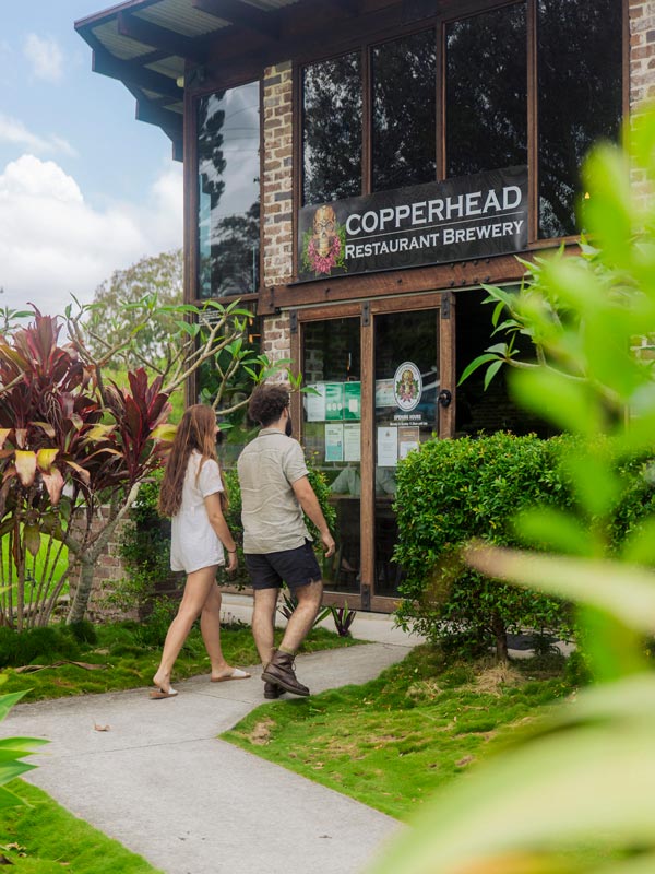 a couple entering Copperhead Brewery, Noosa