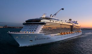 The Royal Caribbean Quantum of the Seas navigating the sea at dusk