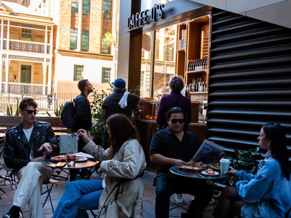 People dining and drinking at Caffe Q's
