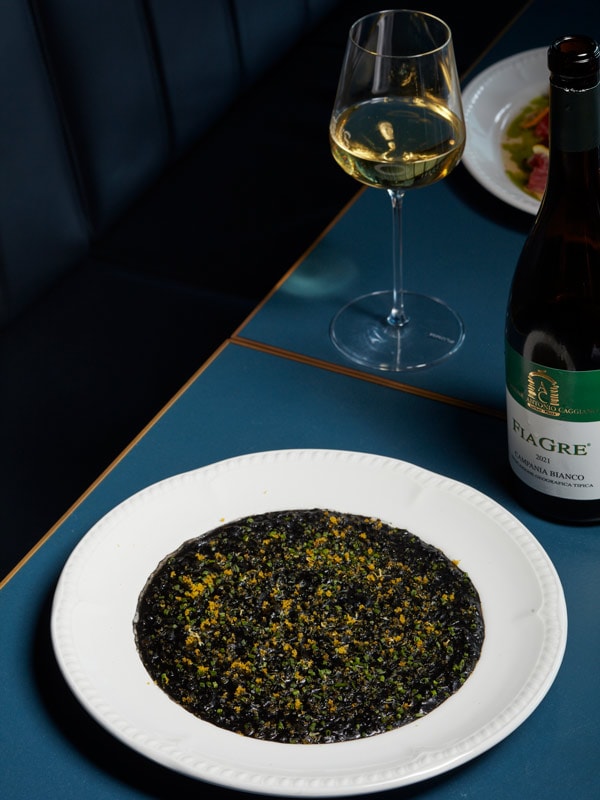 Black pasta with wine at Lola's Italian and Bar in Bondi