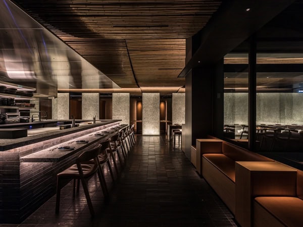 the dining interior of Raku with moody lighting