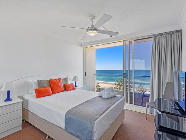 a bedroom with beach view at Southern Cross Beachfront Holiday Apartments