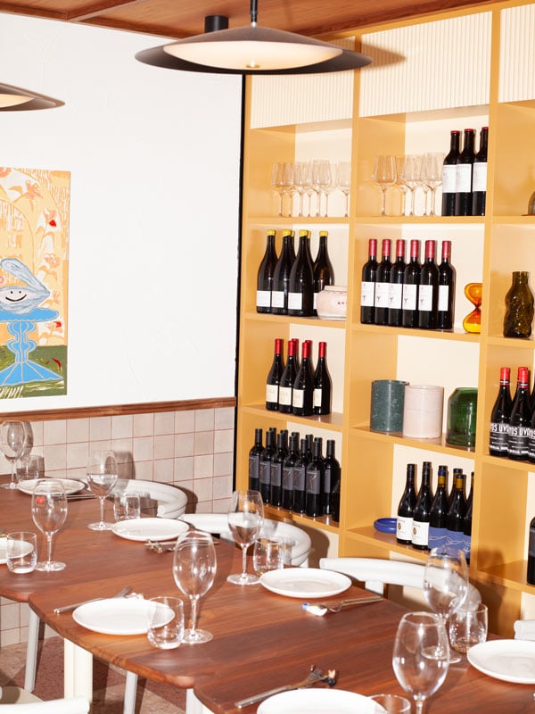 a stack of wines on the side of the tables at Such And Such, Canberra