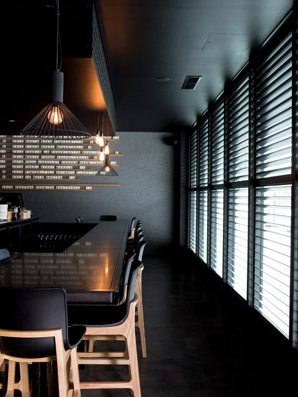 the black and sleek dining interior of Vincent, Canberra