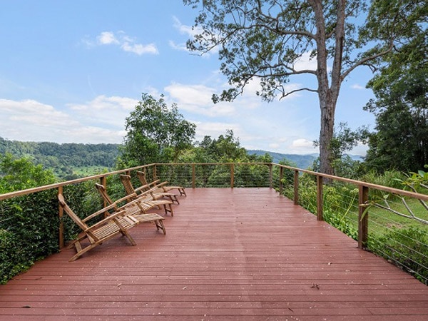 an open-air deck with mountain views at The Escarpment Retreat