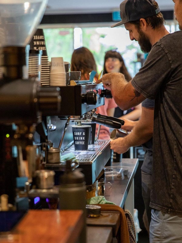 a barista making coffee at Entity Coffee