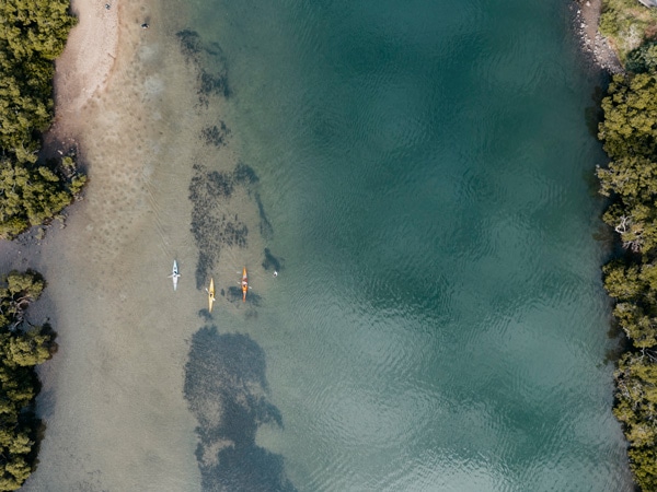 an aerial view of people kayaking on the Minnamurra River on the NSW South Coast