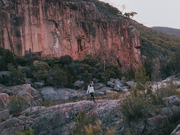 a man walking along Red Rock Gorge, Canberra