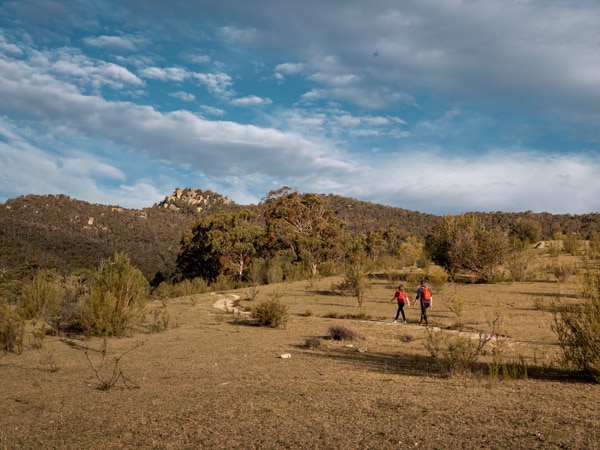 two people navigating the trail along Tidbinbilla Nature Reserve