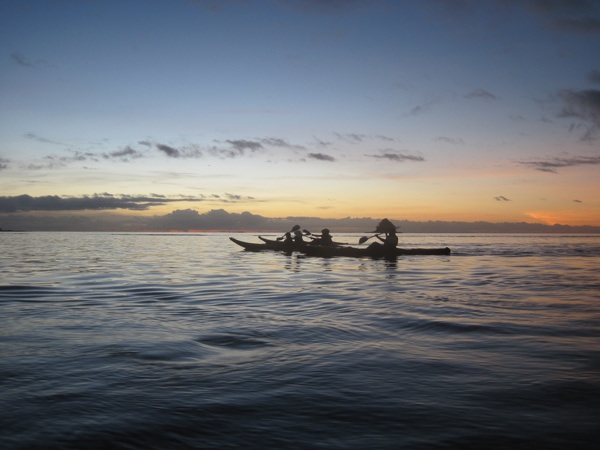 people on a boat paddling at dusk, Pal Cove