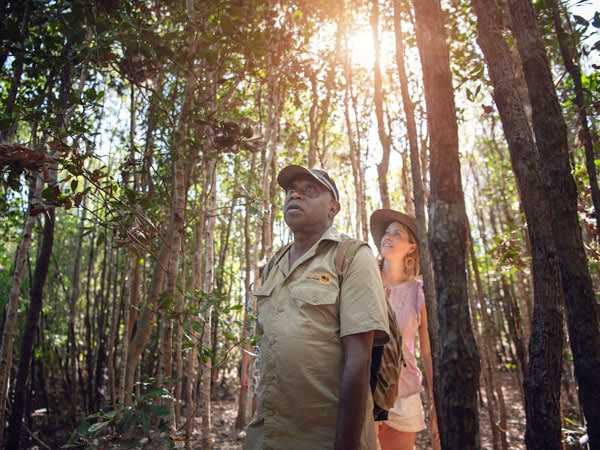 a woman with Victor Cooper of Ayal Aboriginal Tours