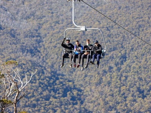 a group of people riding the Kosciuszko Chairlift, Thredbo