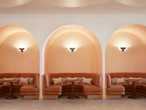 a bright toast-toned walls and couches at 55 North, Sydney