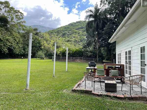a lush garden setting at the outdoor deck of a barn loft Airbnb in Redlynch Valley, Cairns