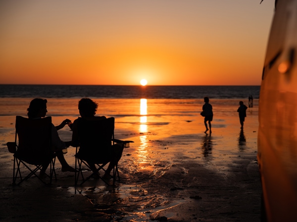 a family relaxing on Cable Beach’s Beach Hut