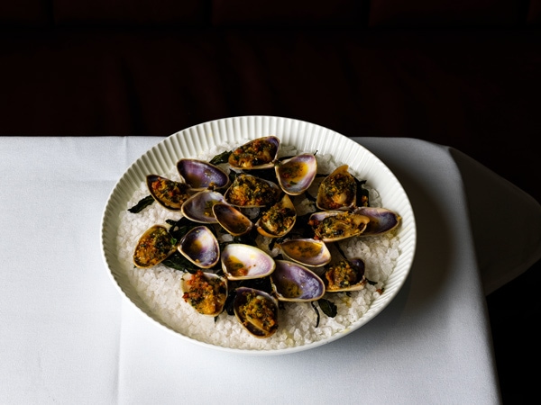 The clams casino with Goolwa pipis, guanciale and pangritata from Bistro George