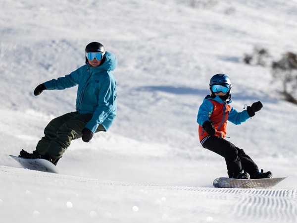 two people skiing at Thredbo Ski Resort