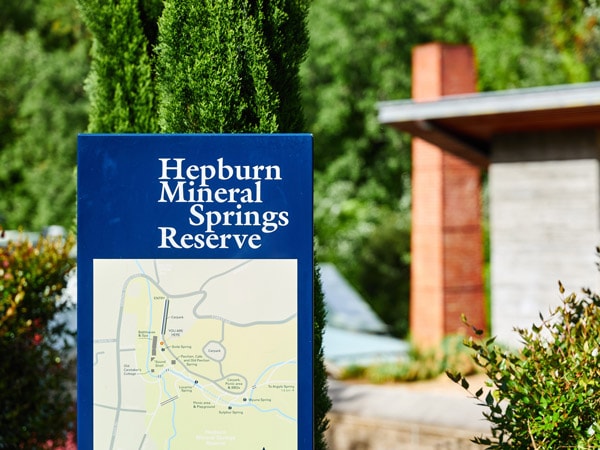 A sign and map of the Hepburn Mineral Springs Reserve