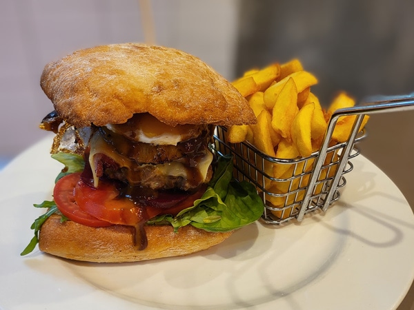 a plate of burger and fries at KG Cafe, Kiama