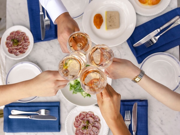 a table-top view of a toast, Bottomless French rosé at Loulou, Sydney