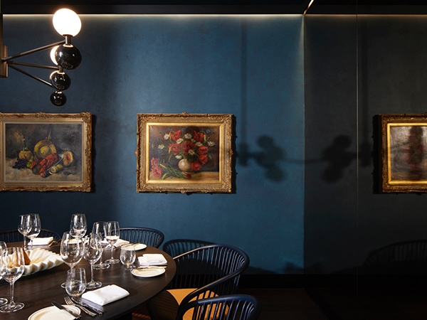 Louis Dining, all dark blues and gold finishes, is a Luchetti Krelle designed restaurant in Canberra at Hotel Realm