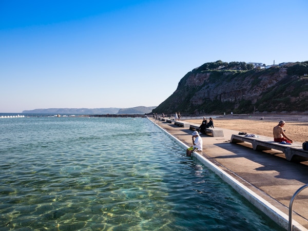 people relaxing at Merewether's Ocean Baths in Newcastle.