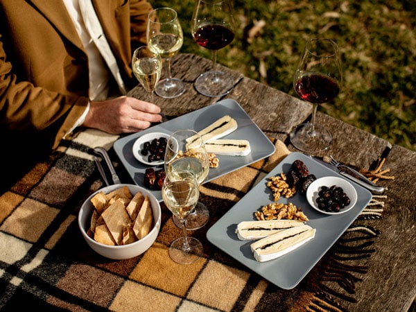 a person enjoying food and drinks on the table, Mount Majura Vineyard, Canberra