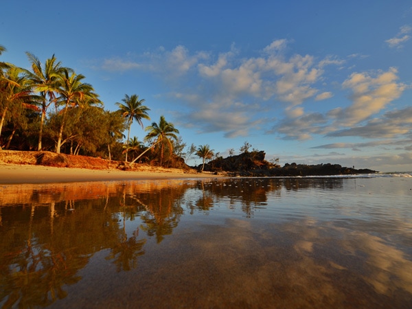 a scenic view of Oak Beach, Cairns at sunset