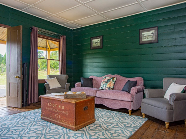 a rustic living room at Sydney Hotel Cottage, Hill End Historic Site