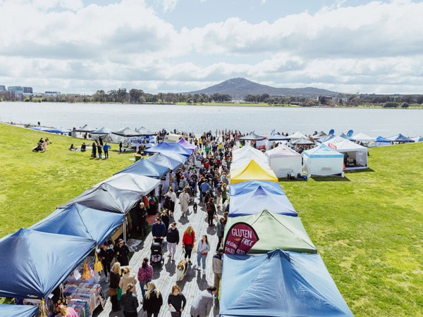 an aerial view of people shopping around the stalls at The Little Burley Market, Canberra