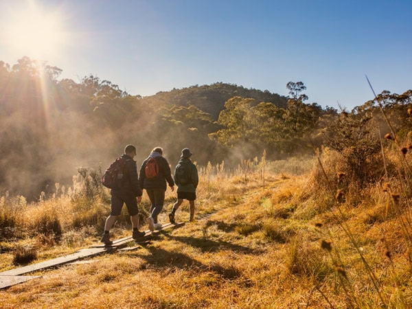 hikers tackling the Tidbinbilla Nature Reserve trail up the Gibraltar Peak