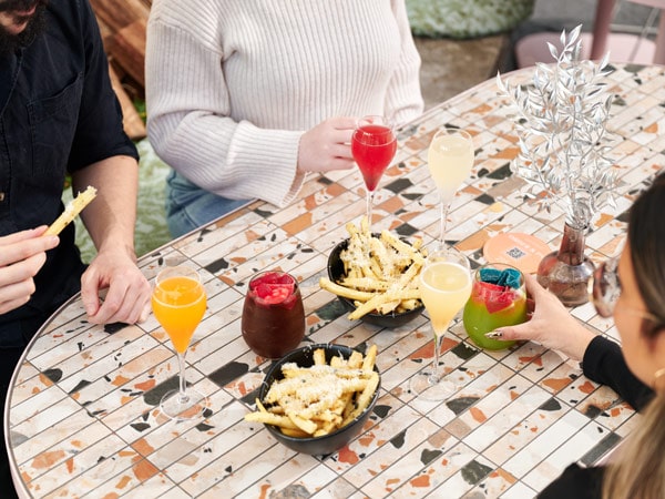 friends enjoying their food at Brunch with Soul at Untied