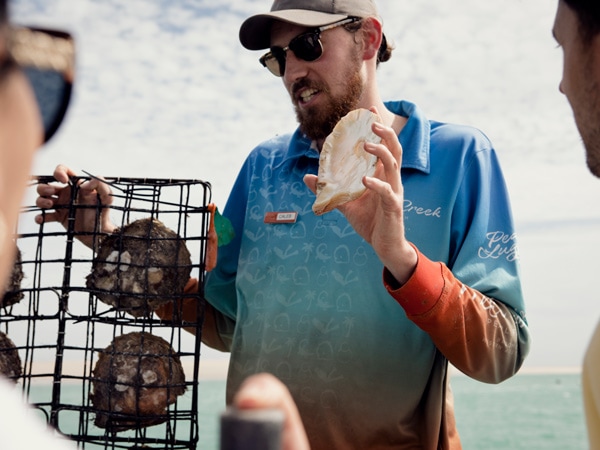 a pearl farmer at Willie Creek Pearl Farm Tour